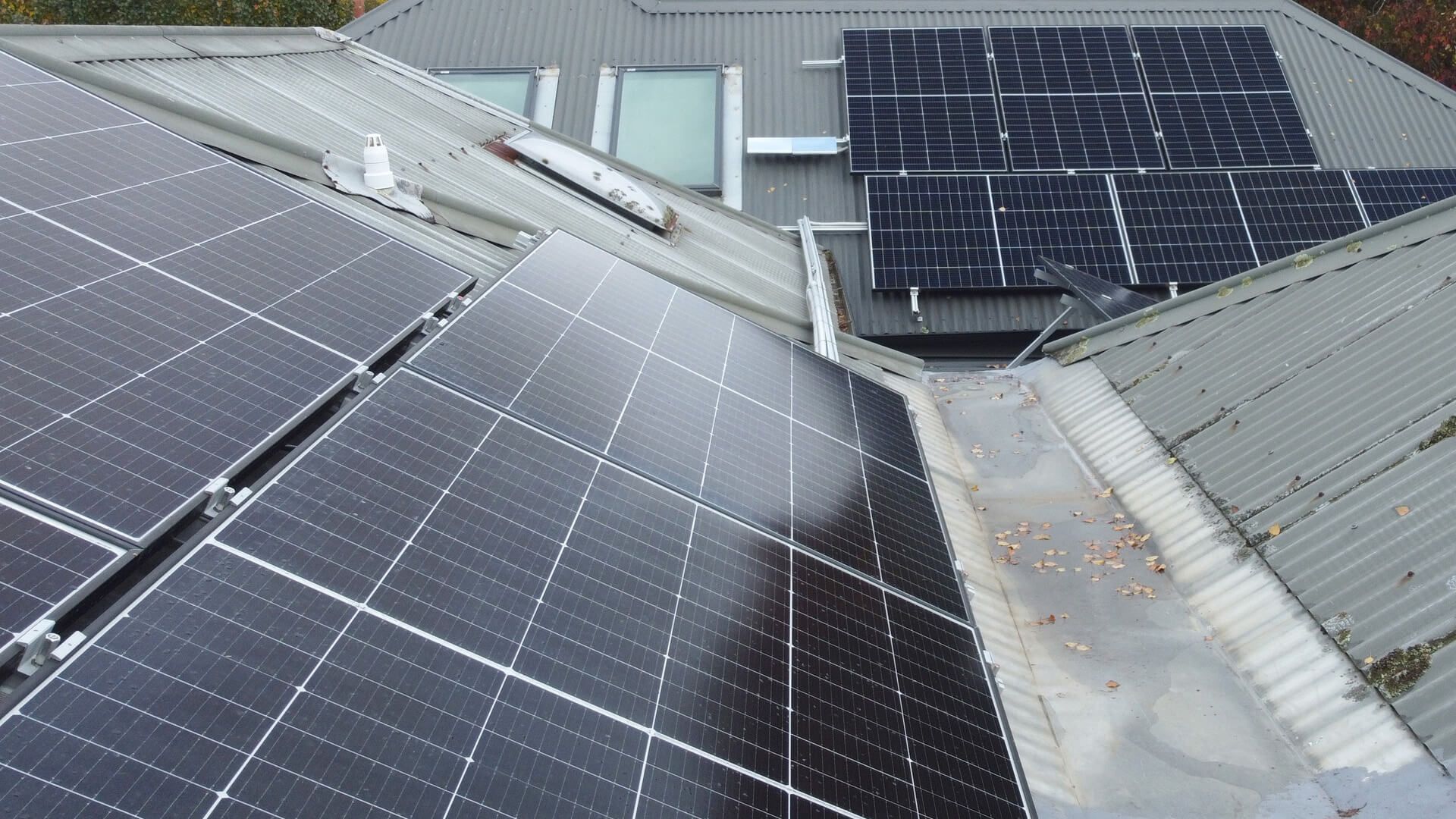 A roof with a lot of solar panels on it