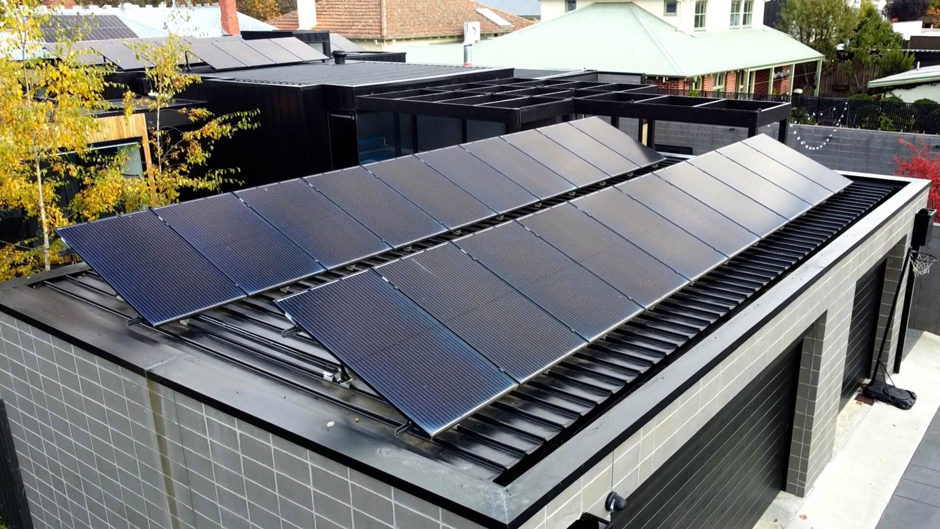 A house with a lot of solar panels on the roof