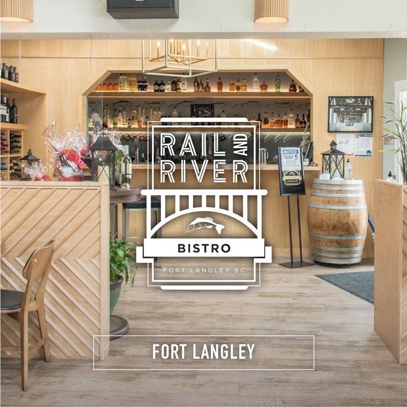 A sign for the rail and river bistro in fort langley