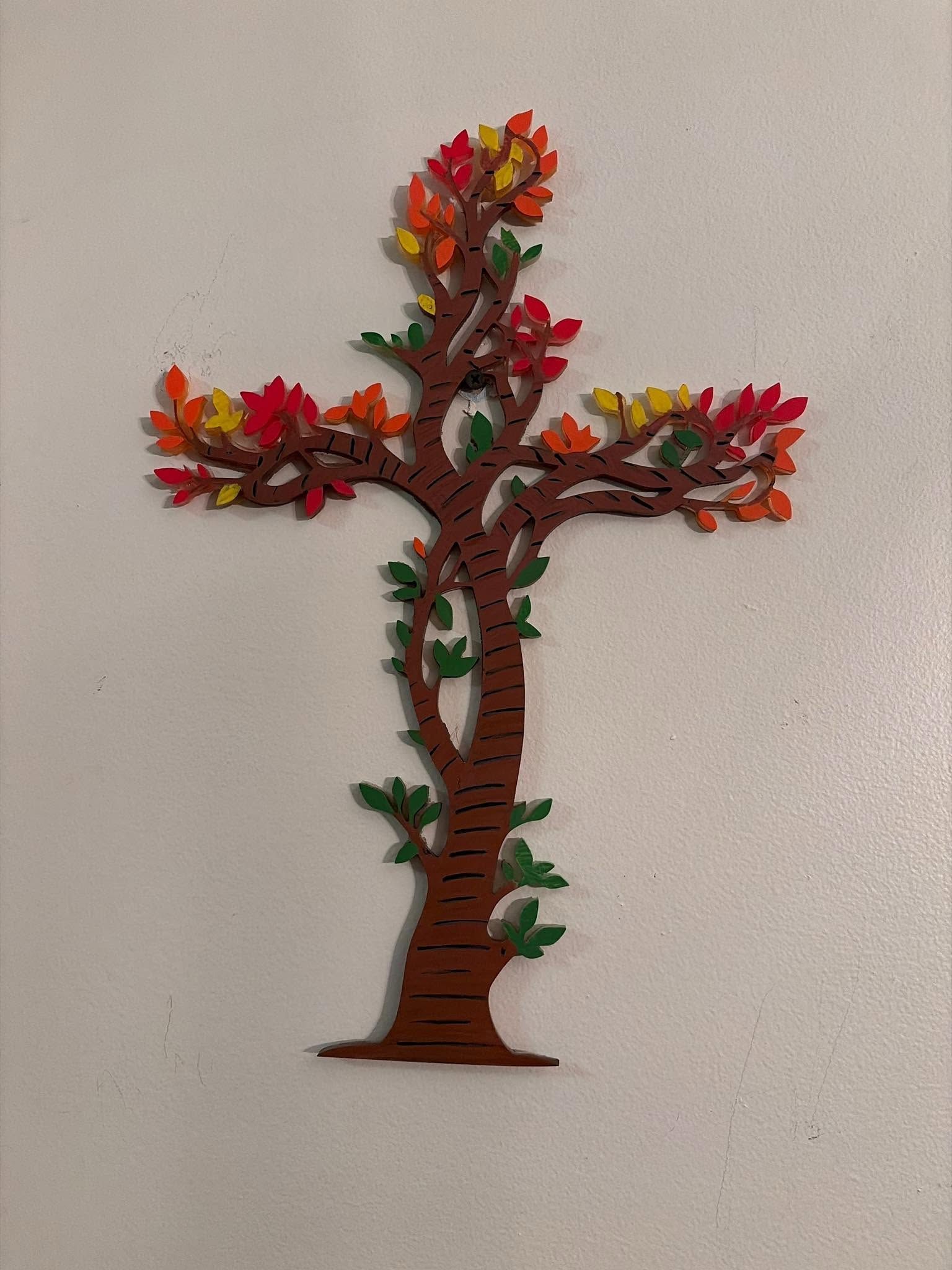 Red and orange autumn tree wall art on a beige background