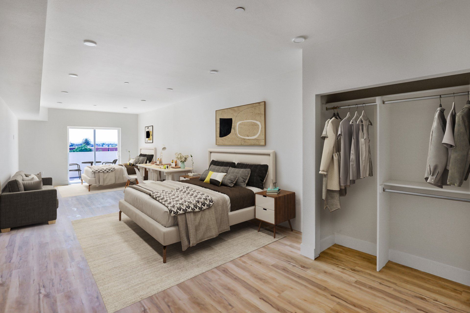 A bedroom with a large bed and a walk in closet.