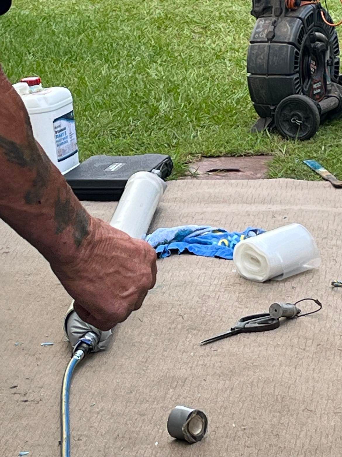 A Man Working on Drain Outside — Nuflow Wide Bay in Bundaberg South, QLD