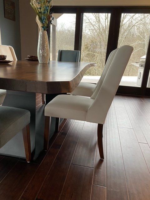 Live edge slab dining room table made by Unique WoodWorx LLC.