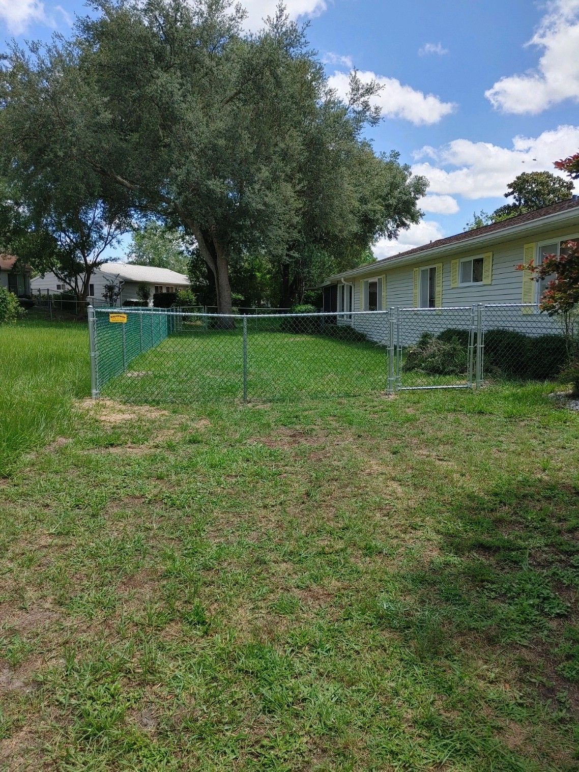 Residential chain link fence installation for a backyard