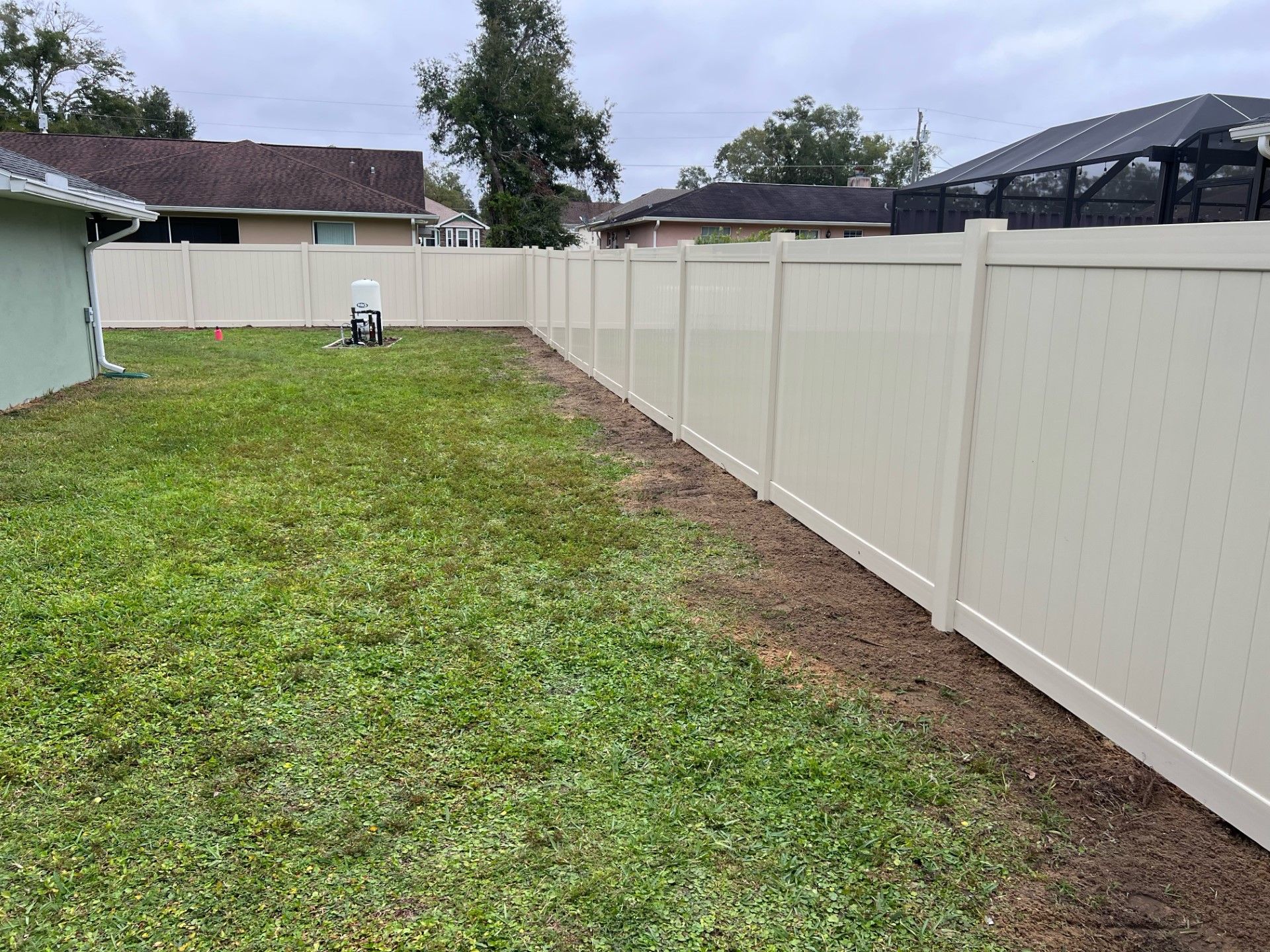Residential privacy vinyl fence installation