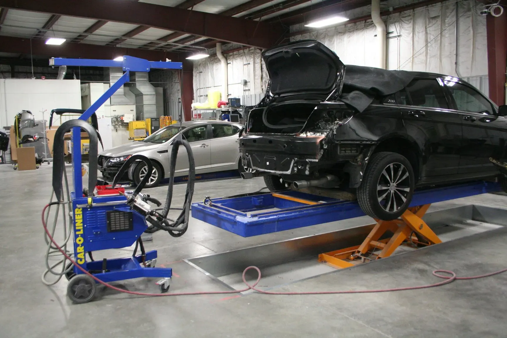 Fixing The Trunk Of A Black Car — St. Peters, MO — Novak’s Collision Center