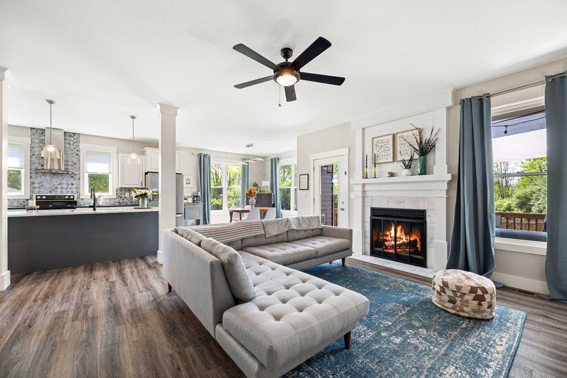 Bright great room with ceiling fan