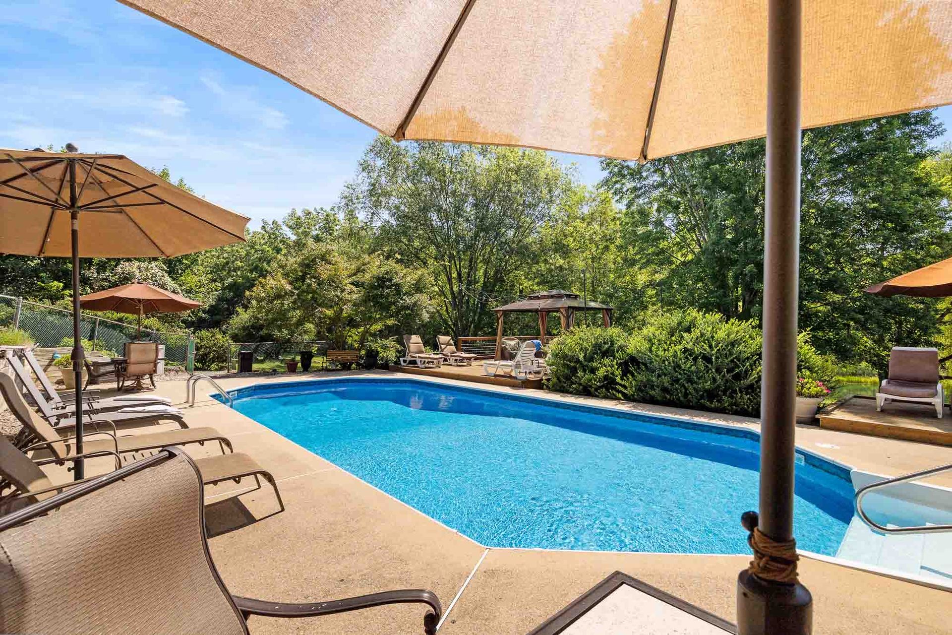 Pool and patio under sun shade