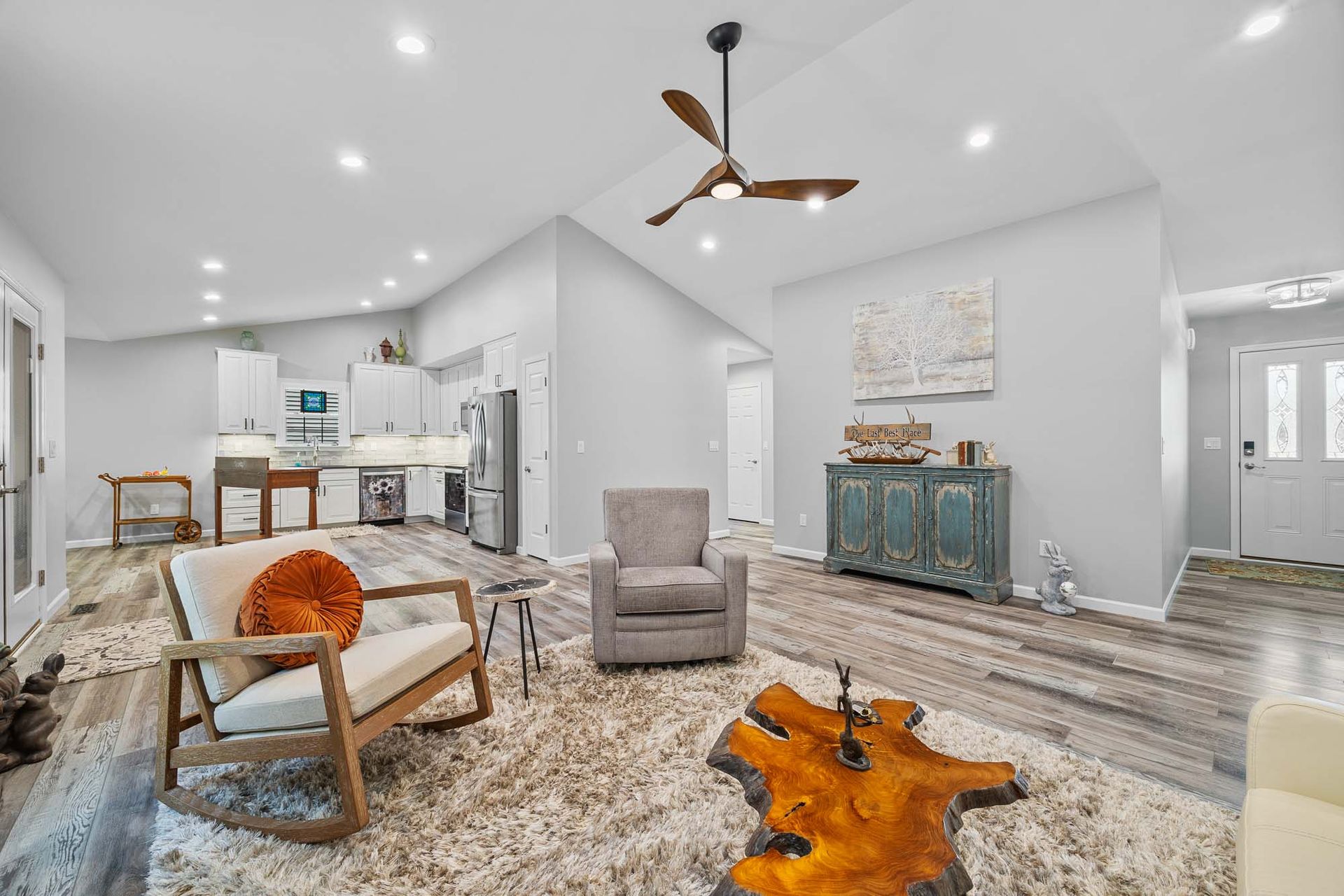 Cozy den with fireplace and wood tones