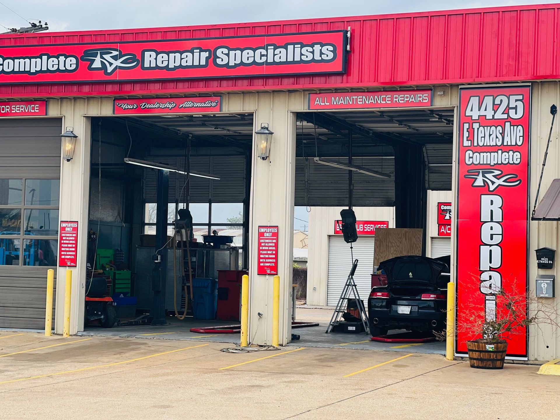 A garage with a red sign that says repair specialists