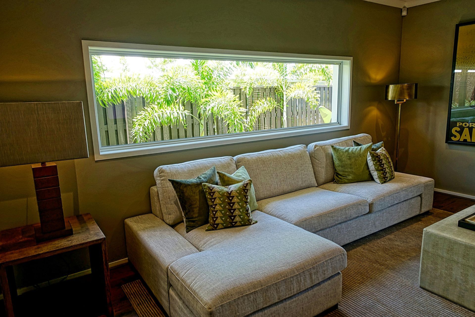 a living room with a couch and a large window