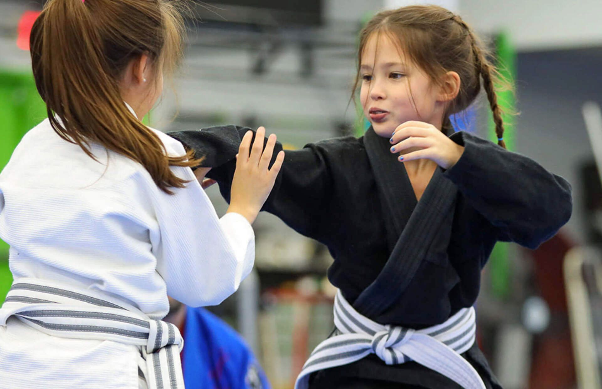 two you students practicing self defense as beginner students