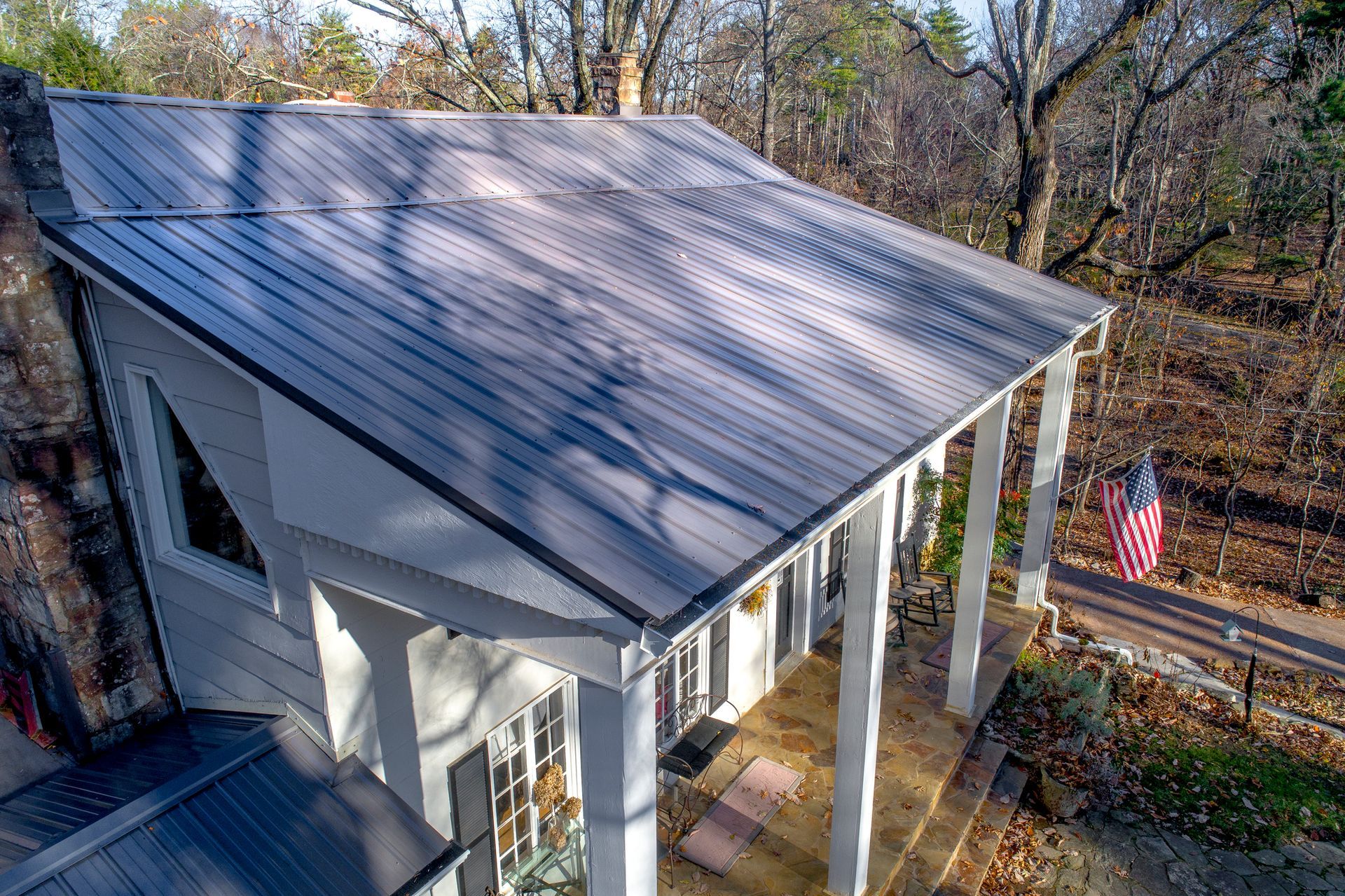 An aerial view of a porch with a metal roof.