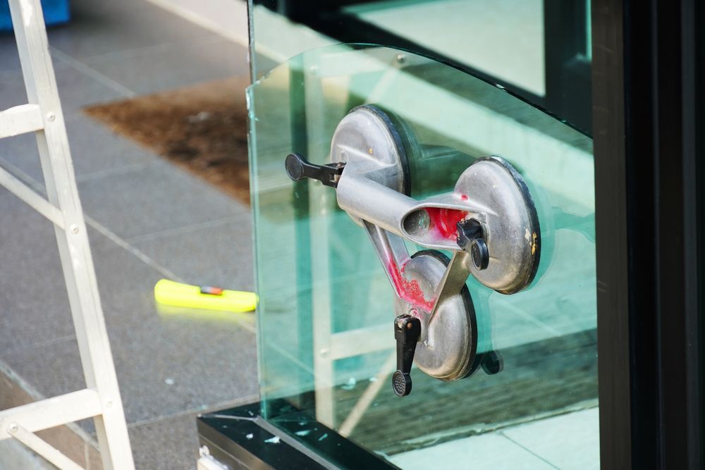 Tools Mounted on A Glass Panel, Including a Suction Cup Handle — Fast Glass & Glazing In Barraba, NSW
