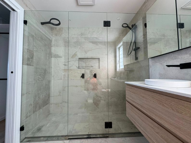 A Bathroom With a Walk in Shower and a Sink — Fast Glass & Glazing In Manilla, NSW