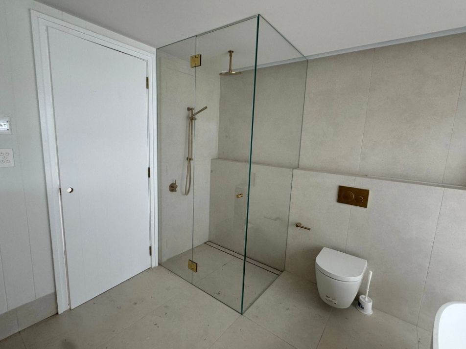 A Bathroom With a Walk in Shower and Two Sinks — Fast Glass & Glazing In Inverell, NSW
