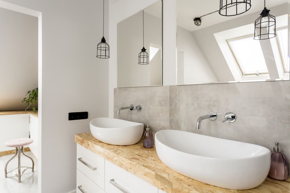 A bathroom with two sinks and a mirror — Fast Glass & Glazing In Barraba, NSW