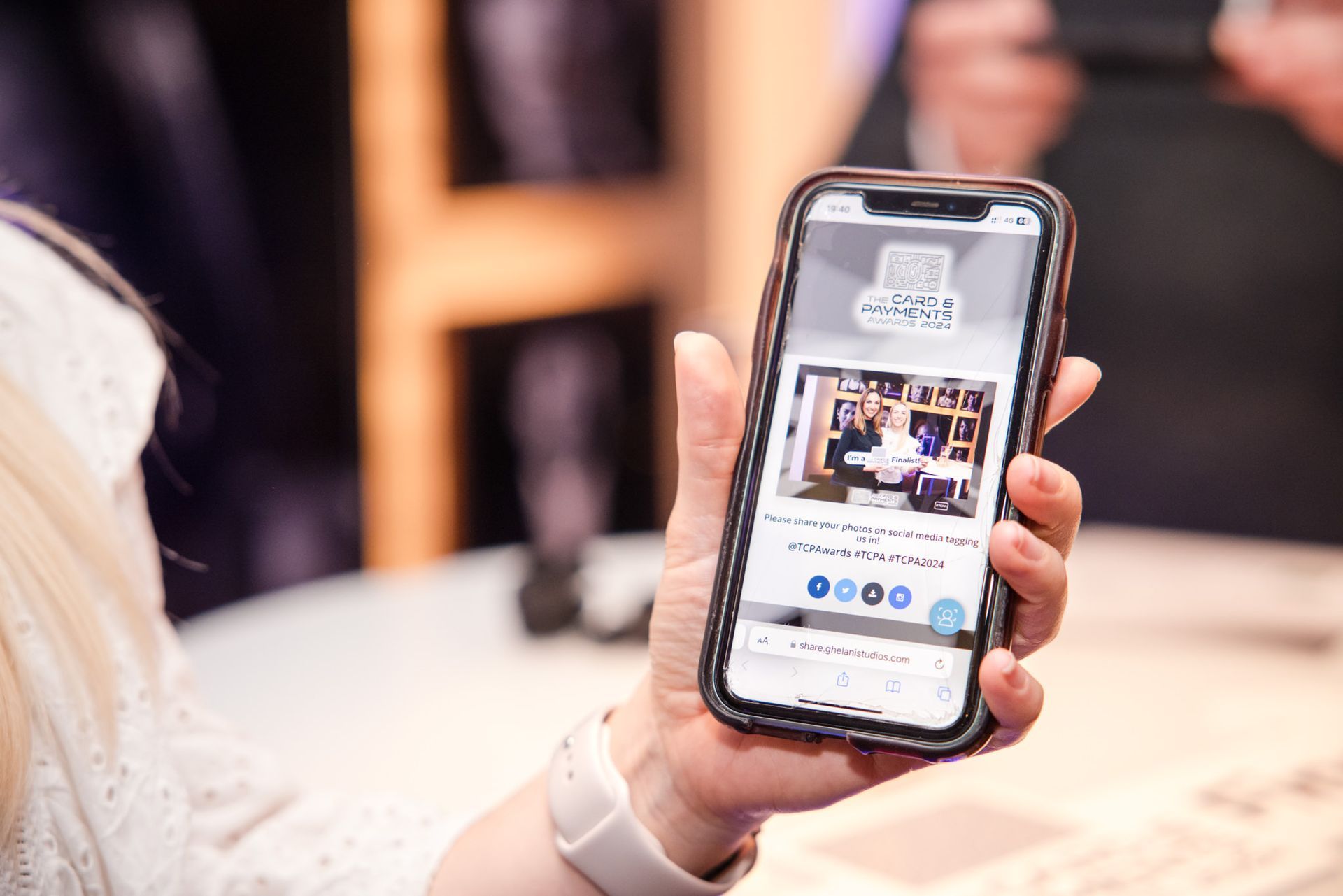 This photo shows the guest sharing the photo she just received from our photographer and is now able to download and share it
