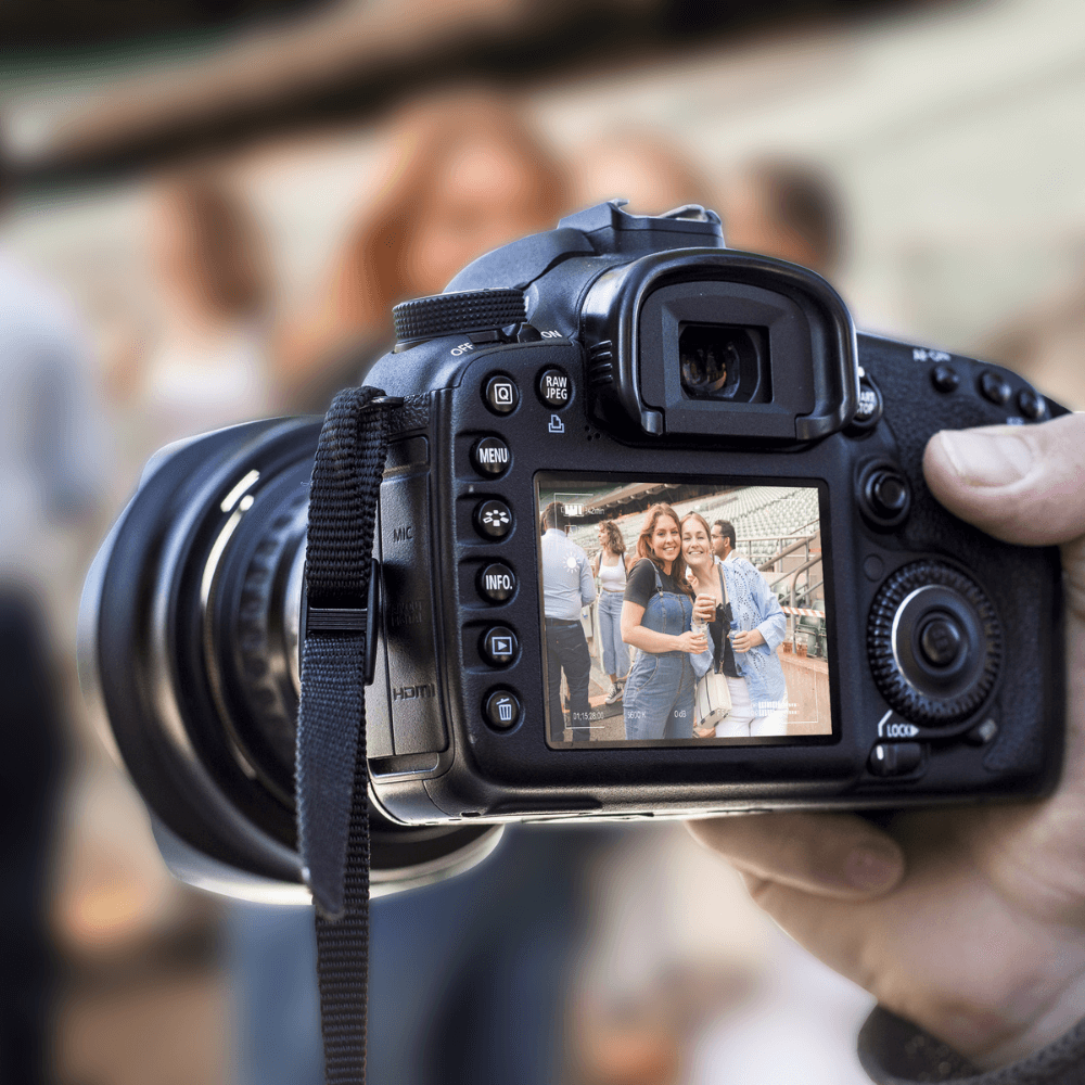 Polaroid photographer takes photo at event