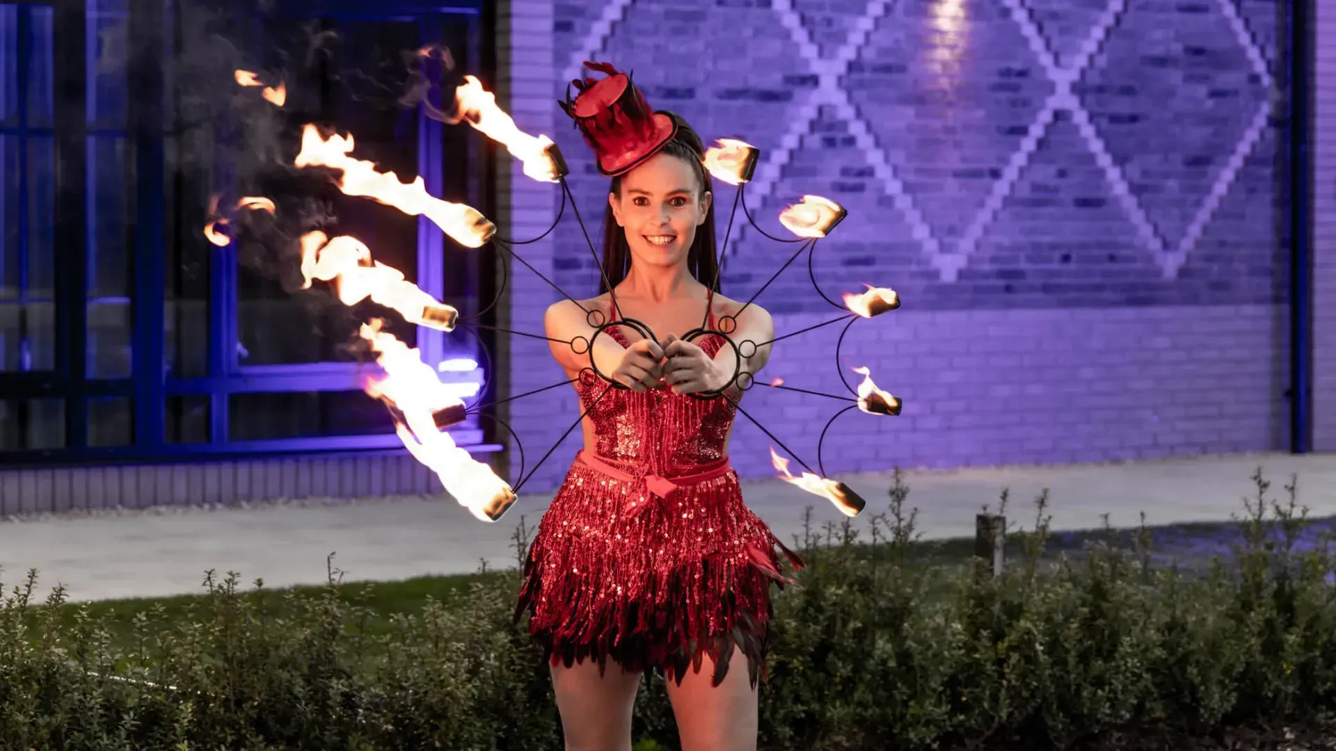 Artist performer juggling fire at a corporate party