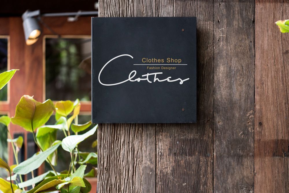 A Sign On A Wooden Wall That Says Clothes Shop — JW Signs and Designs In Emerald, QLD