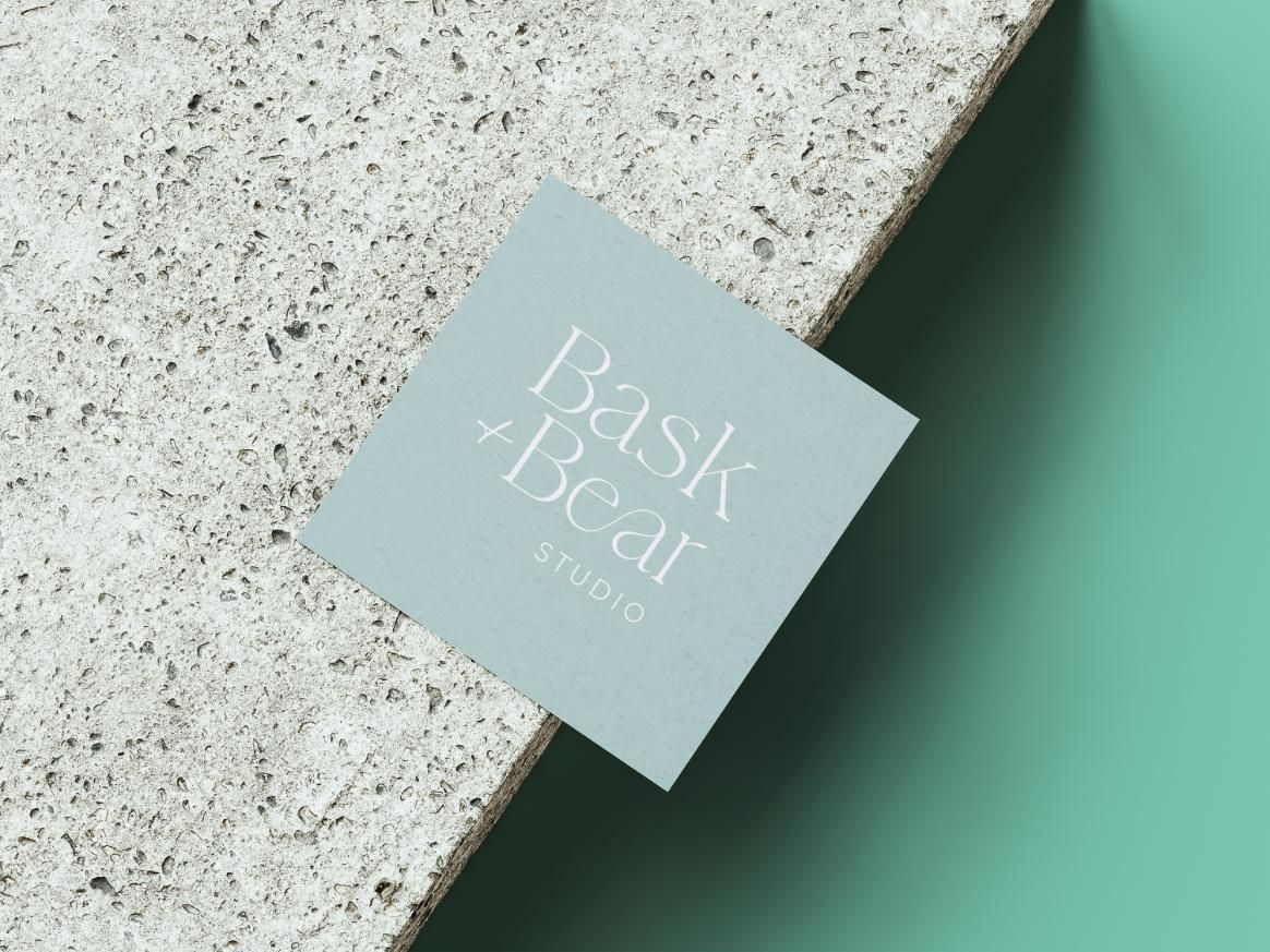 A Business Card Is Sitting On A Granite Counter Top — JW Signs and Designs In Mount Isa, QLD