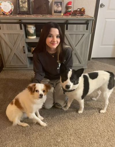 Ruffin' Around employee with her dogs.