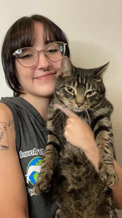 Ruffin' Around employee with her cat.