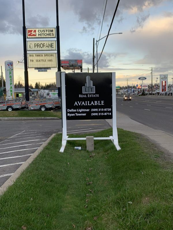 A real estate sign reading 