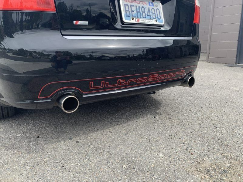 Rear view of a black Audi with an 