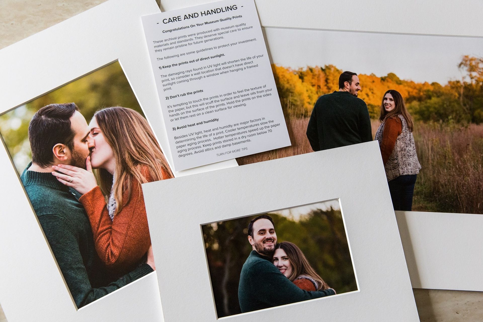 A man and a woman are kissing on a piece of paper.