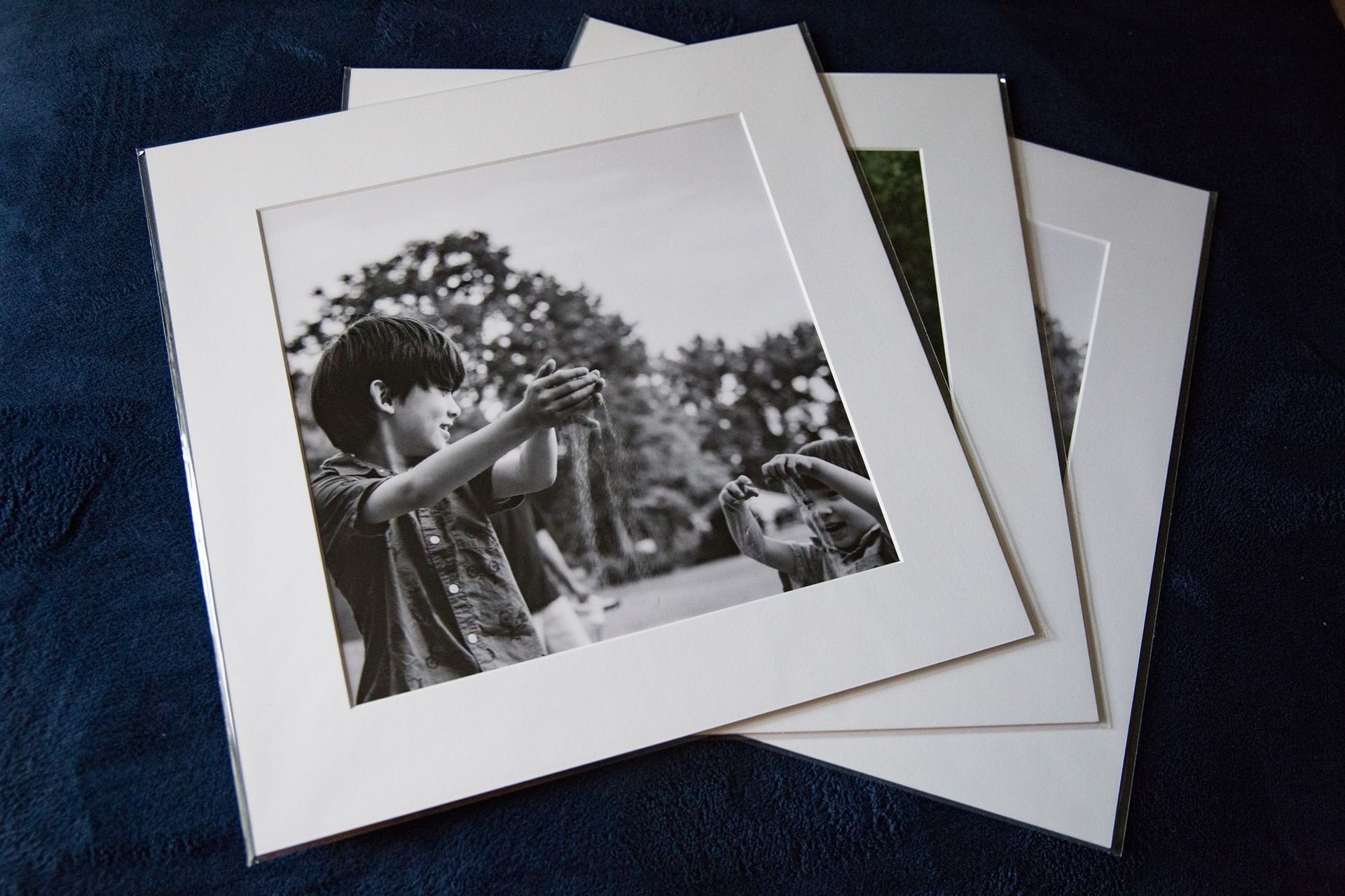 A black and white photo of a boy taking a picture