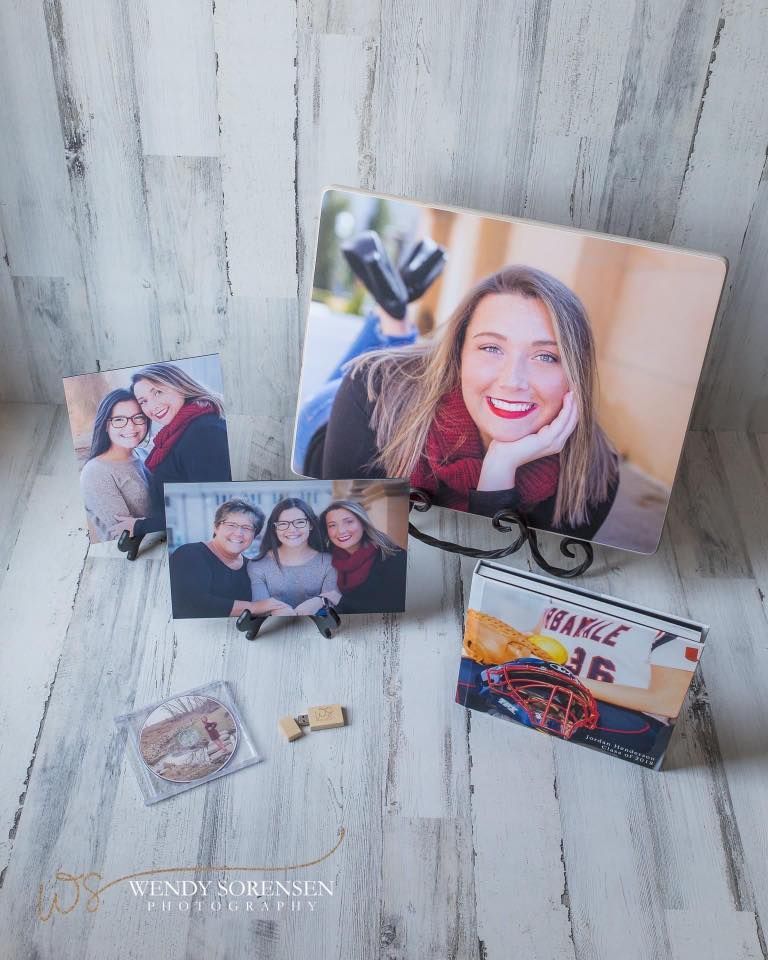 A group of pictures sitting on top of a wooden table.