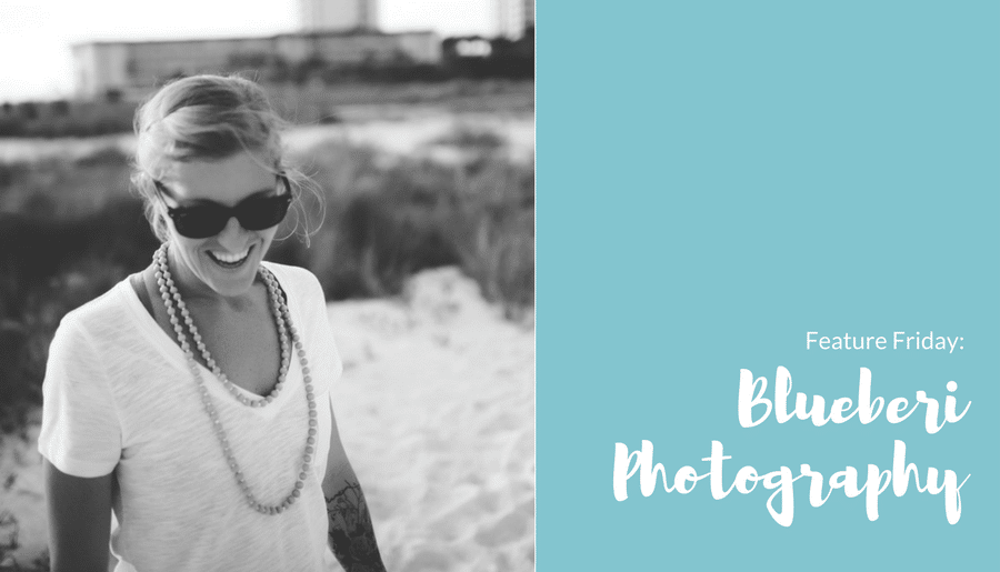 A black and white photo of a woman wearing sunglasses and a white shirt.