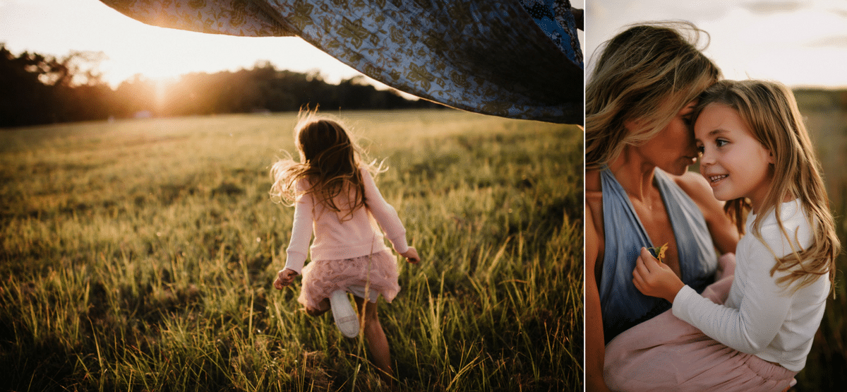 A mother and daughter are playing in a field at sunset.