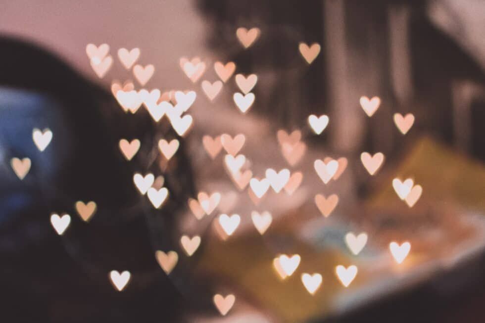 A blurry picture of hearts flying in the air