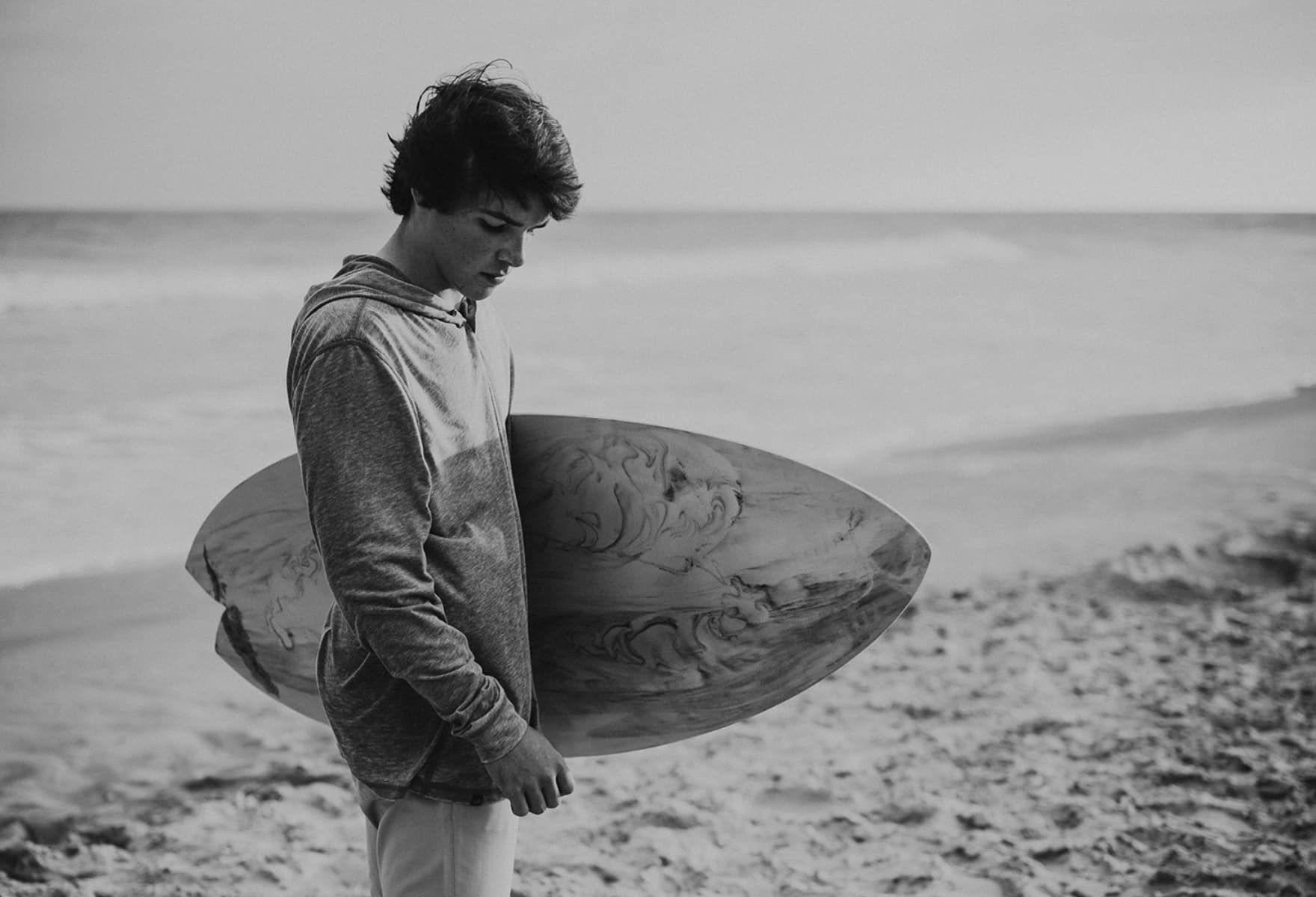 a young surfer on a beach a young surfer on a beach