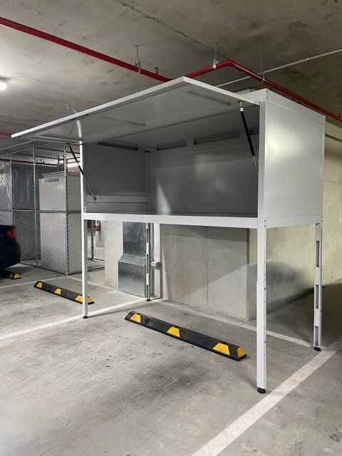 Over bonnet storage unit with the gate open