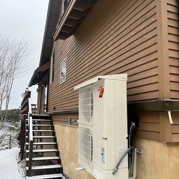 There is a staircase leading up to the side of the house.