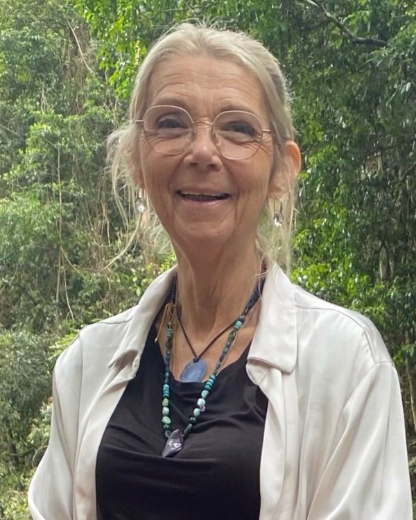 Sandie, life transition coach, smiling in the rainforest