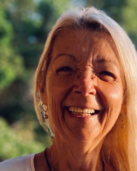 Sandie smiling outdoors