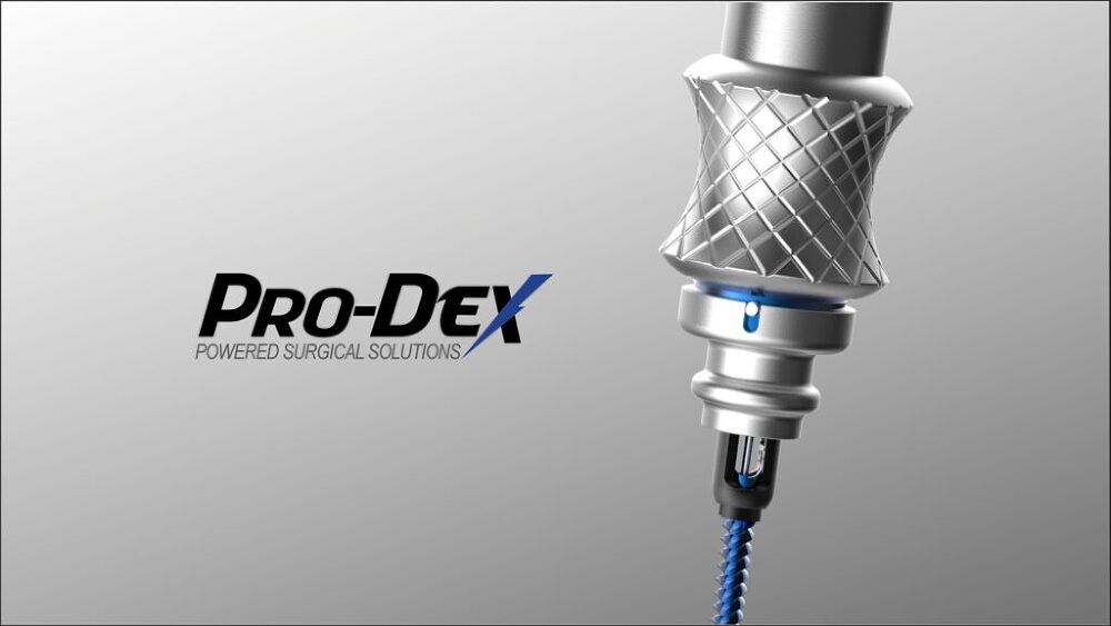 Pro-Dex logo beside a metallic dental tool drilling into a blue material