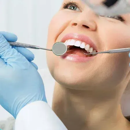 Dentist checking teeth