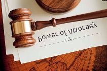 Judge’s gavel on a document beside a map, with “BOMG OF WFOLVGA” text visible.