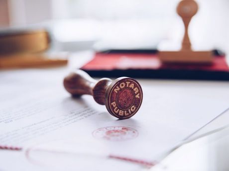 A notary public stamp is sitting on top of a piece of paper.