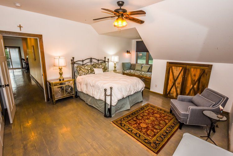 Bedroom of barn apartment. Airbnb rental with supports the mission of the farm.