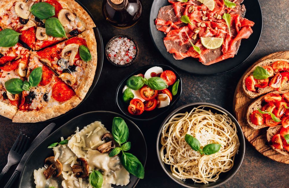 There Are Many Different Types of Food on the Table — Michelangelos Pizza & Pasta in Hermit Park, QLD