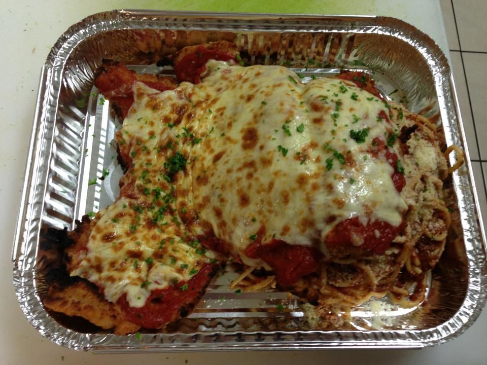 A Foil Container Filled With Chicken Parmesan and Spaghetti — Michelangelos Pizza & Pasta in Burdell, QLD