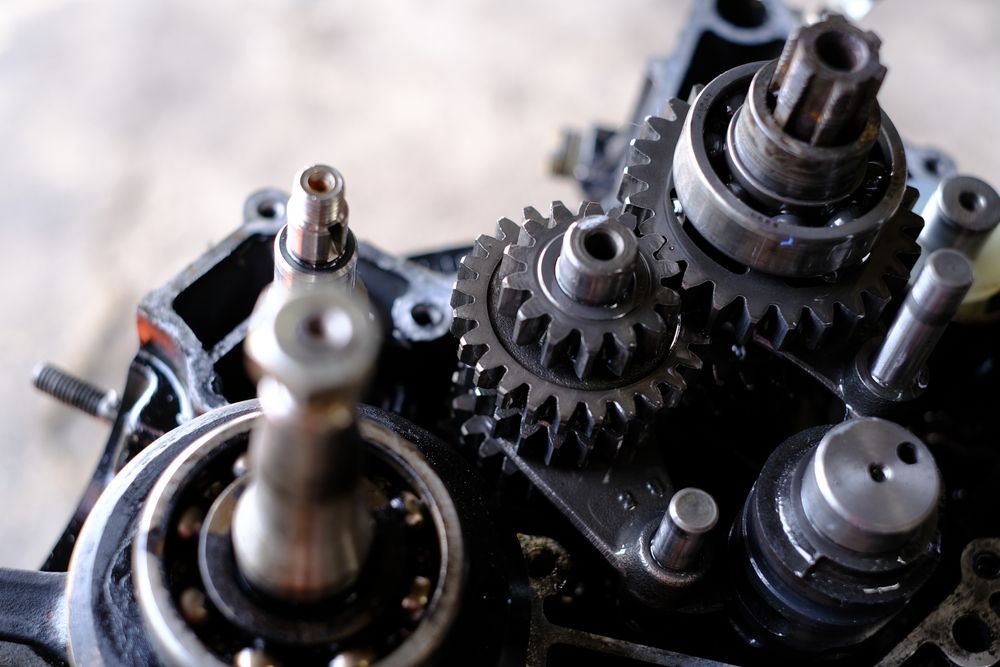 Close-up of Engine Gears and Bearings Inside a Black Machine Housing — Bob Kolln Automotive In Toukley, NSW