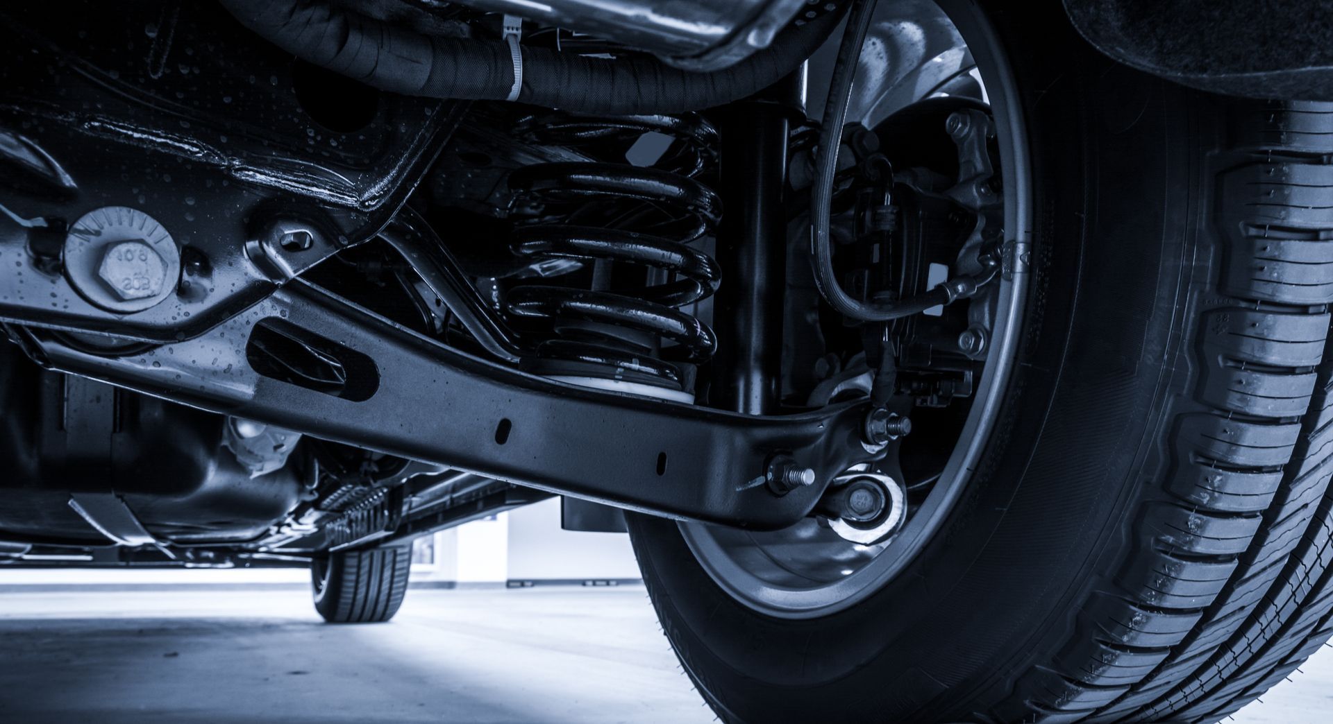 Undercarriage of a Black Vehicle, Showing Suspension — Bob Kolln Automotive In Warnervale, NSW